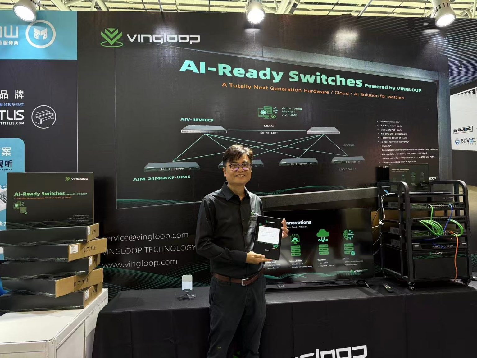 VINGLOOP booth at ProLight+Sound Guangzhou with AI-Ready Switches backdrop and demonstration rack